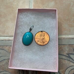 Turquoise stone set in silver.